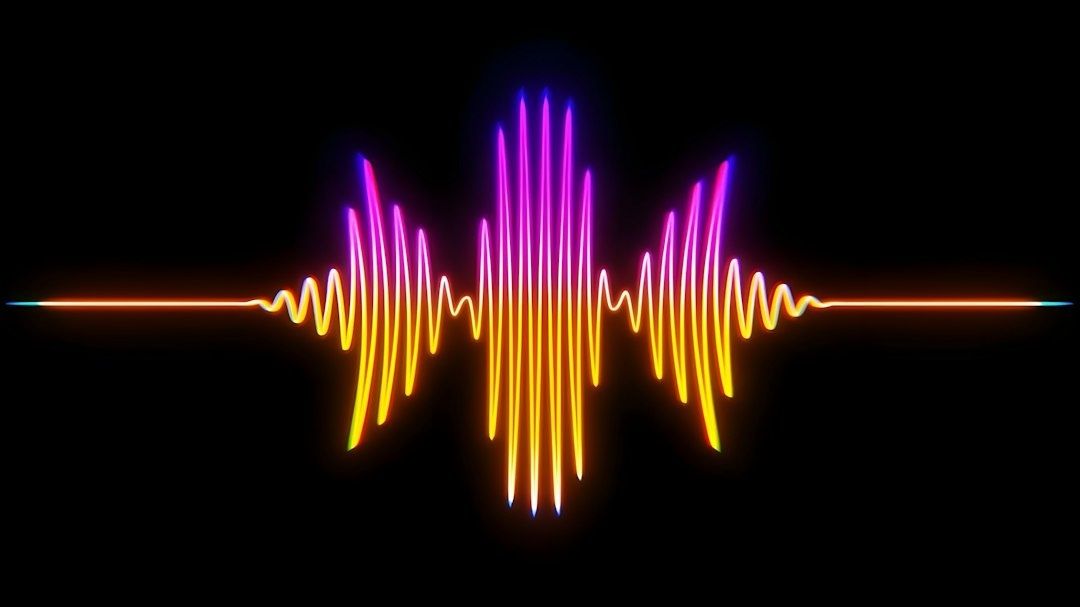 Kleurrijke geluidsgolf op zwarte achtergrond als symbool voor muziekstreaming